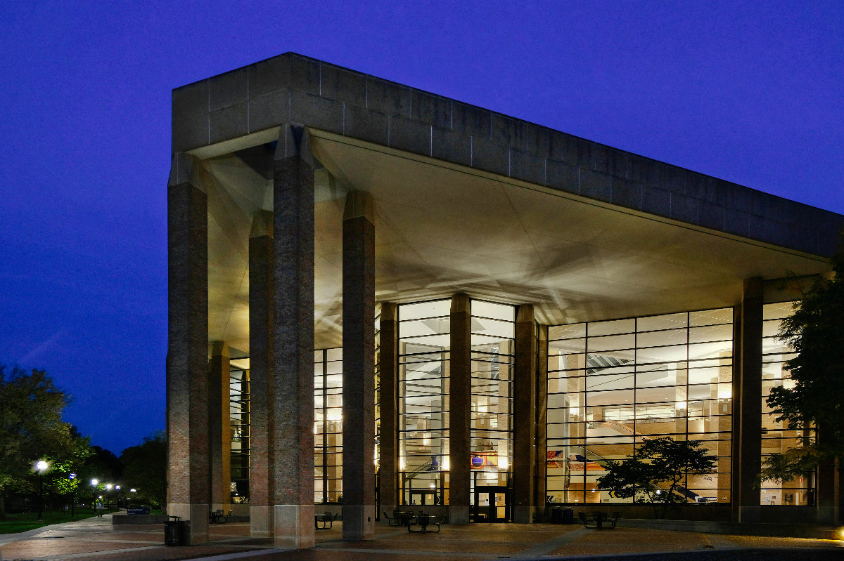 view of the exterior of The Duderstadt Center in the evening