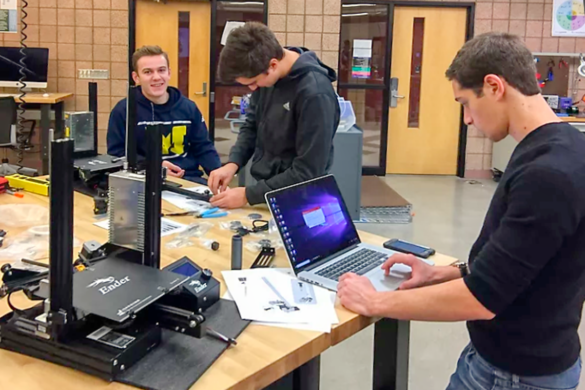 image of members of the U-M 3D Printing Club at work in the Ground Connections Fabrication Studio