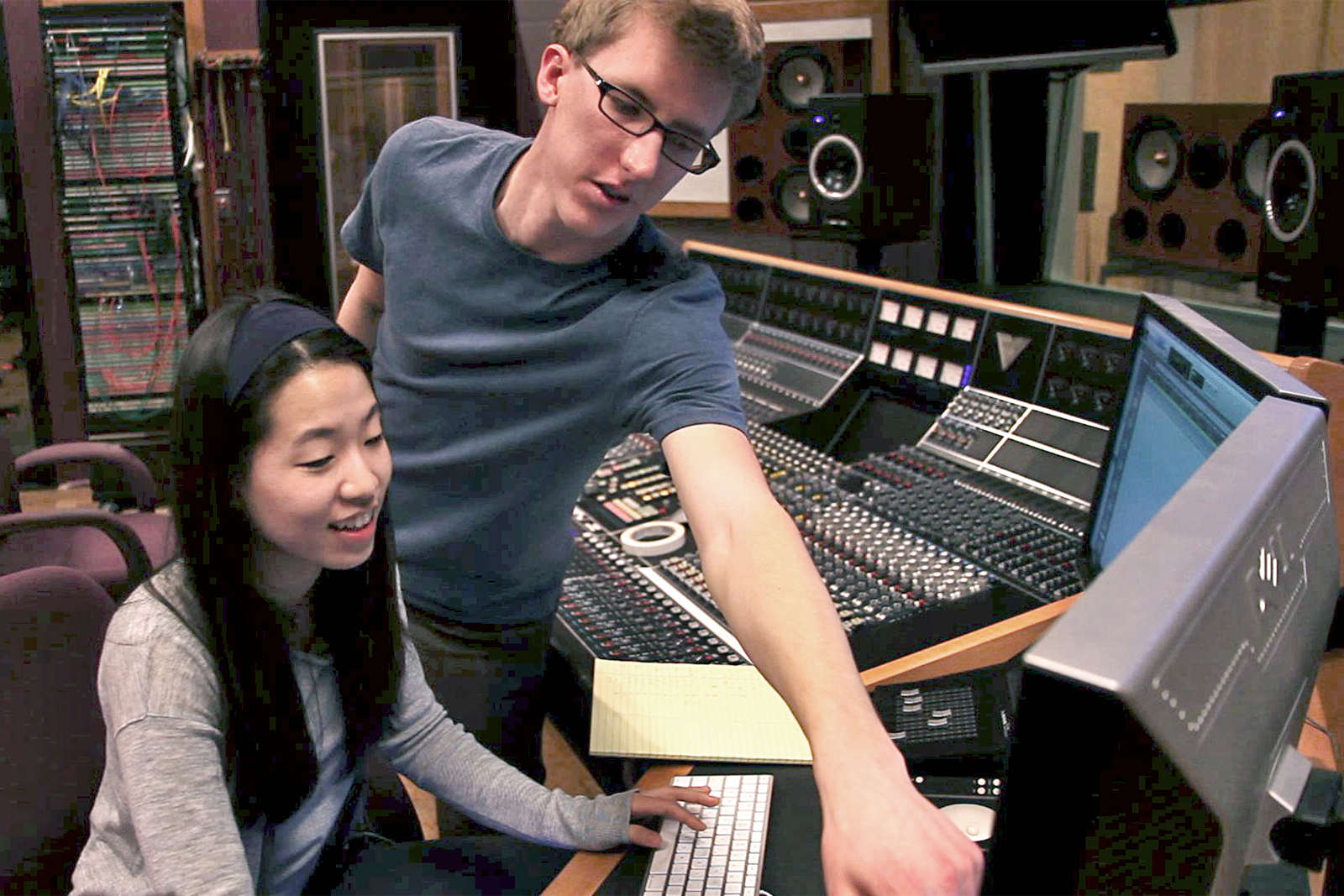 A student advisor provides advice and orientation to a user in Audio Studio A - one of the most advanced audio production studios in any university in the U.S.