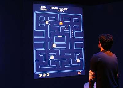 Student looking at Pacman game screen