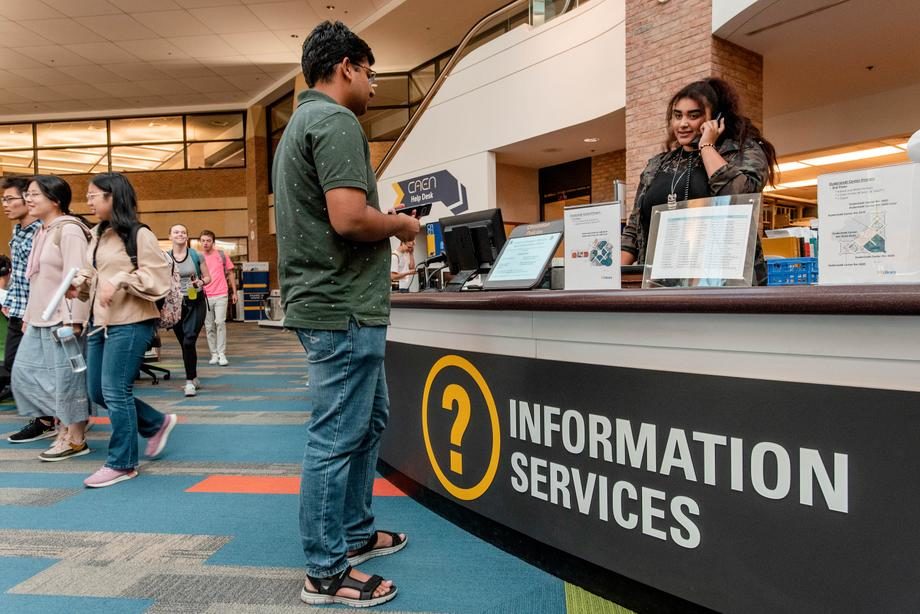 The 2nd floor Information Desk, where students and staff of the U-M AAEL (Library), CAEN, and DMC are ready to help