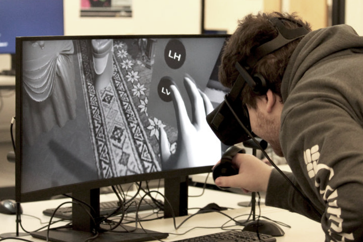 A student works on an extended reality (XR) interactive reproduction of the Set used for the movie "Citizen Kane"