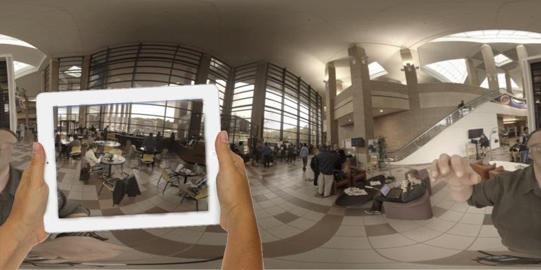 a view of a tablet computer being used to capture an image of a building interior