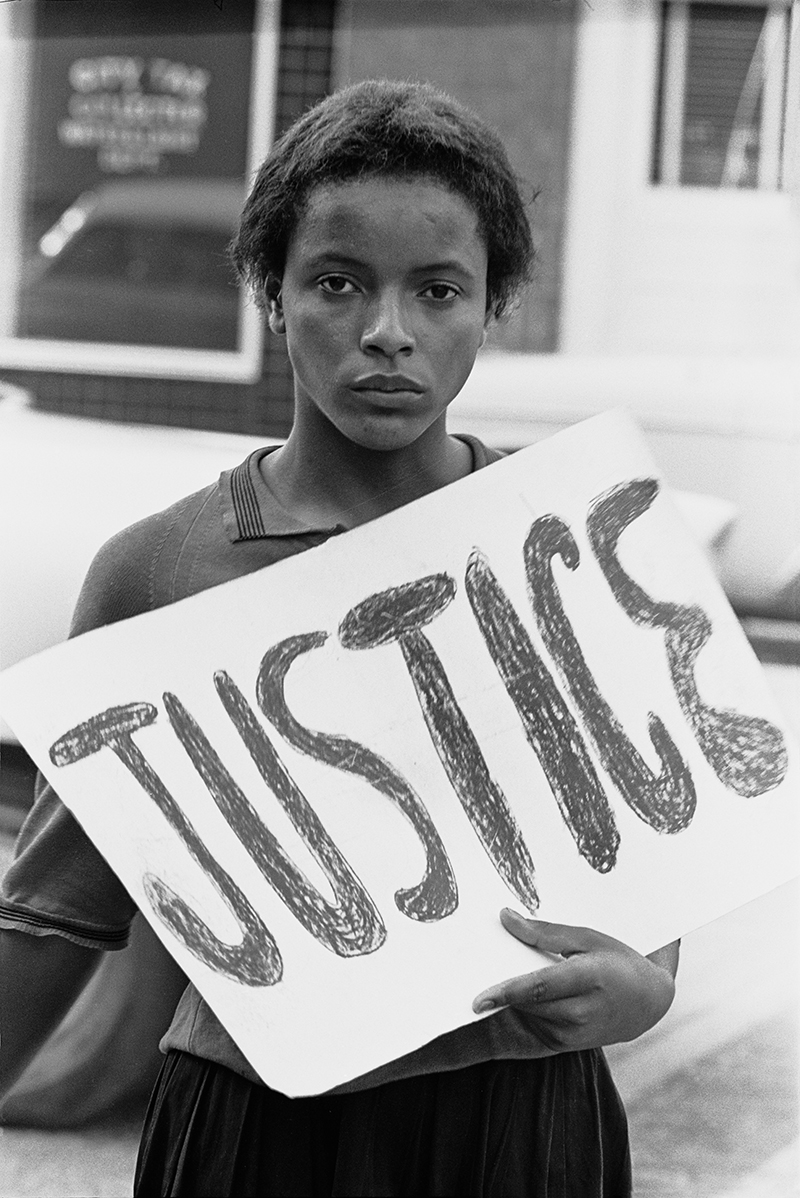 Woman holding Justice sign