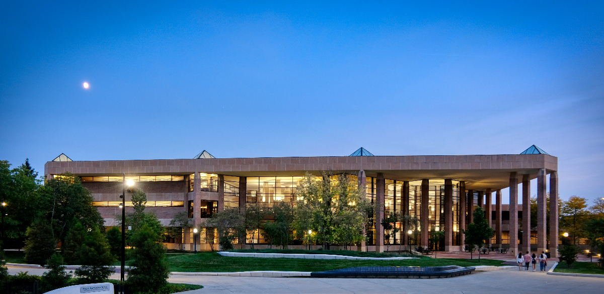 photos of the exterior of The James and Anne Duderstadt Center viewed at twilight
