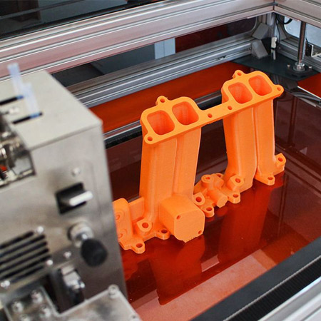 Image of a complete automotive engine manifold 3D-printed with a BigRep Studio printer