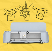 Cricut machine on a yellow background.