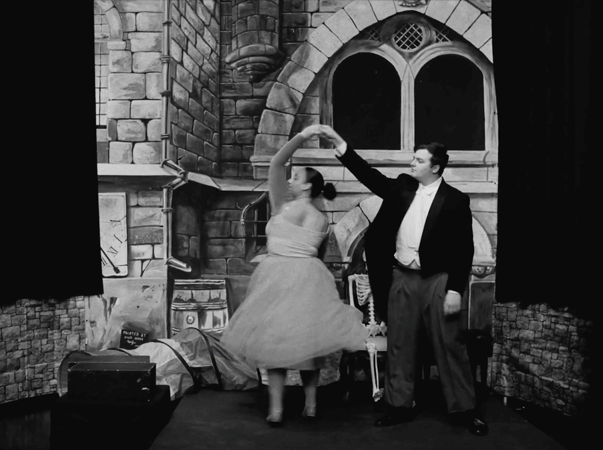 Couple dancing on old black & white film.