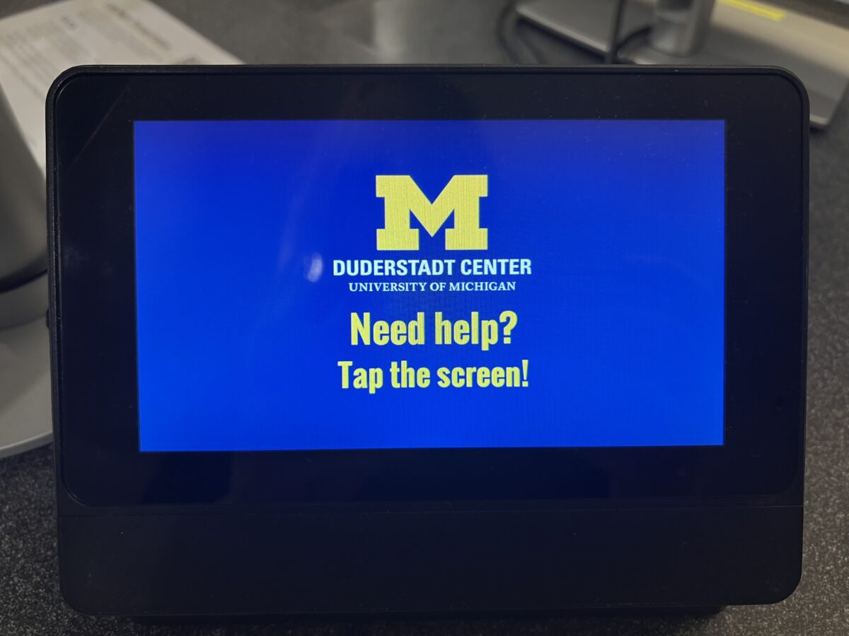 Help screen with UMich logo block followed with the message "Need help? Tap the screen!"