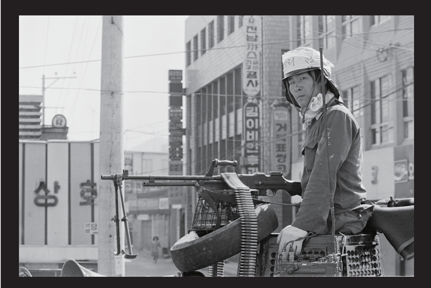 Photo of armed soldier during Korean protests for democracy.