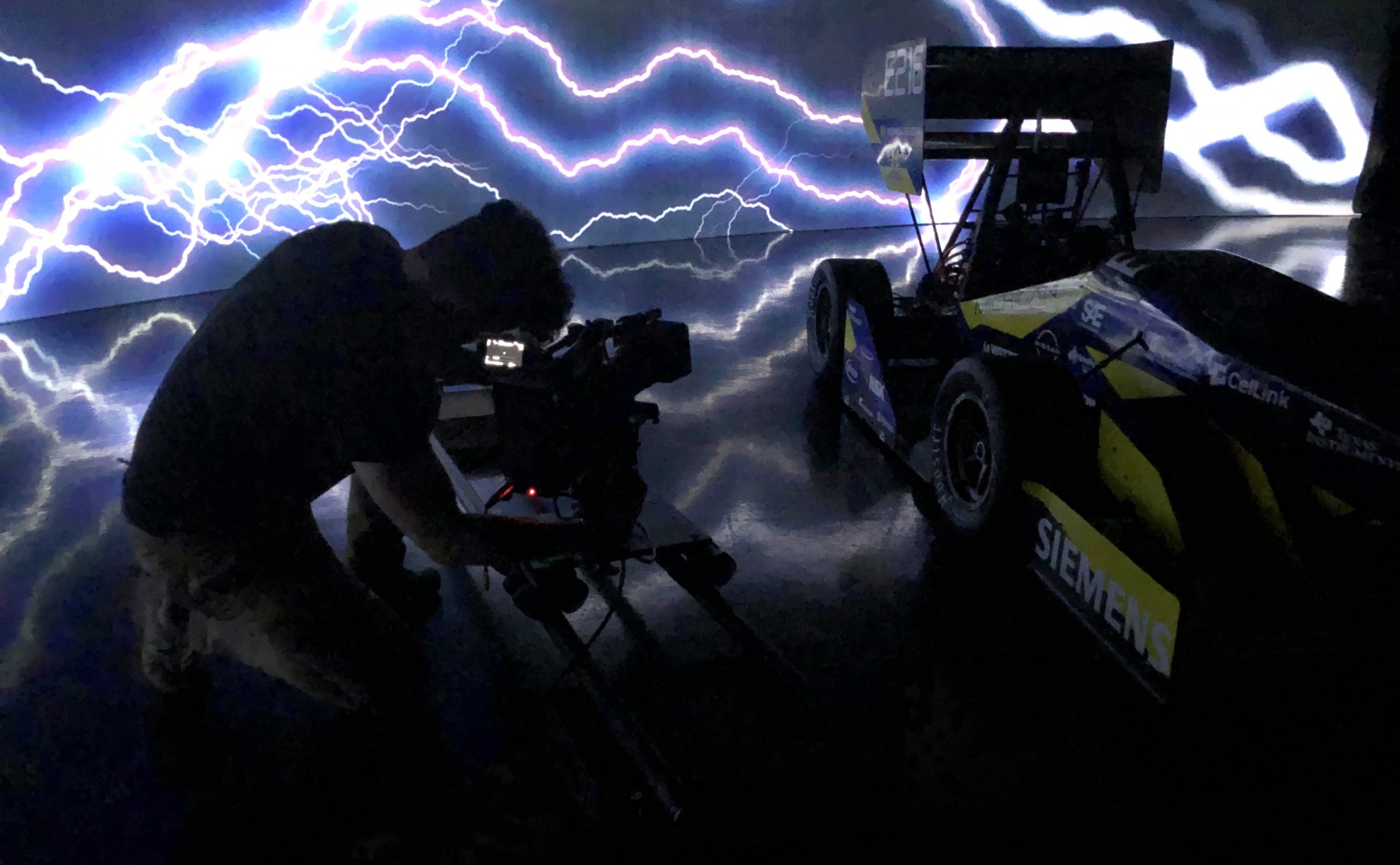 Sean Phelan films the launch video for the College of Engineering's Michigan Electric Racing MER20 vehicle "