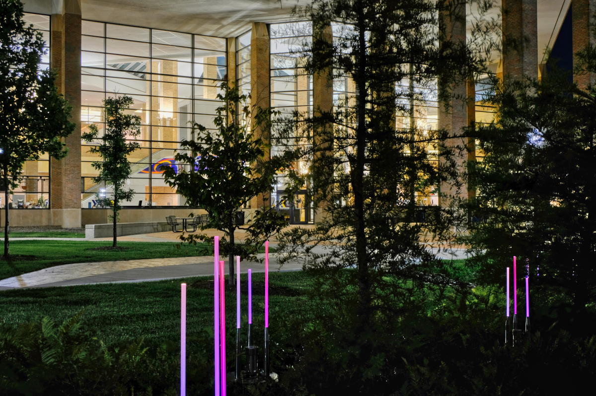 The Duderstadt at night with glowing light wands in the surrounding landscape