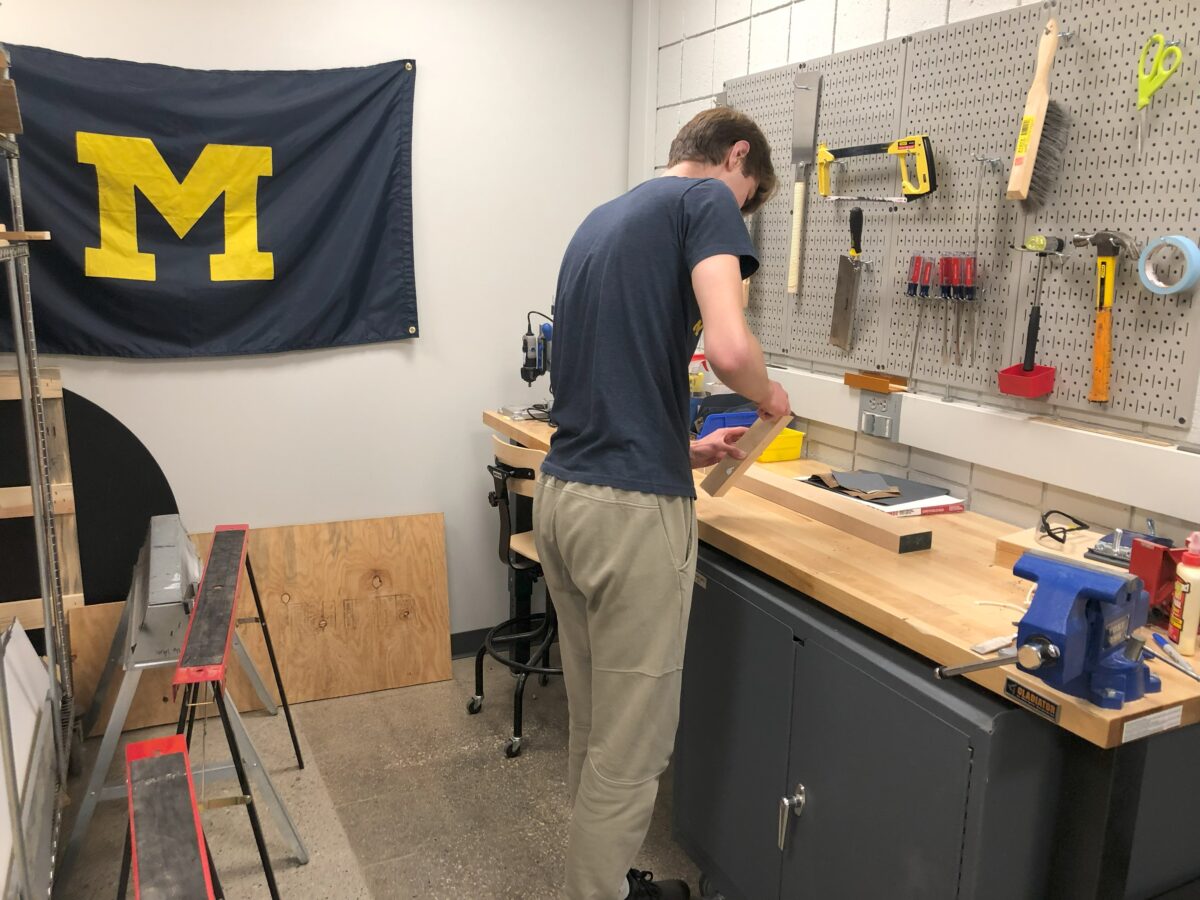 Student working at woodshop