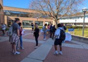 Photo of CBS reporter interviewing students.