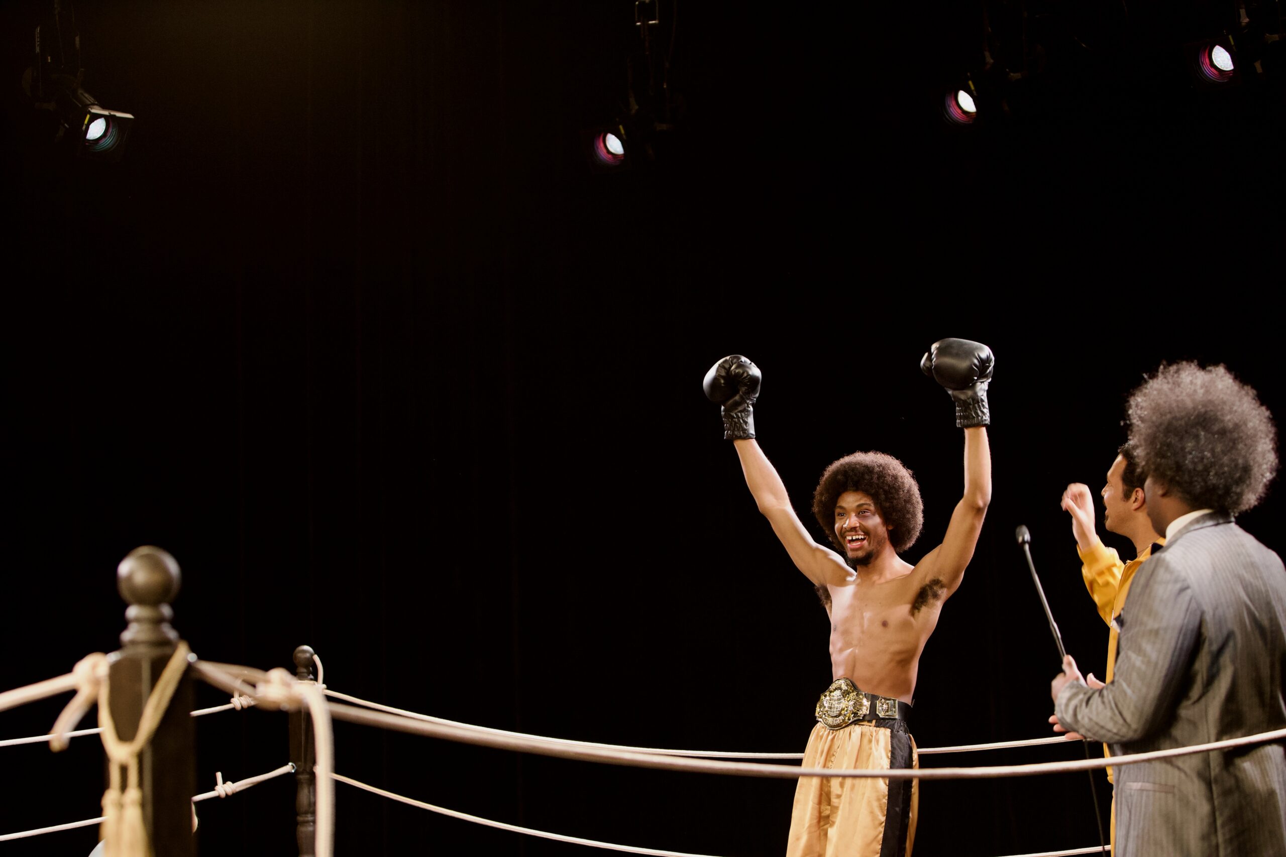 boxer rising his arms up