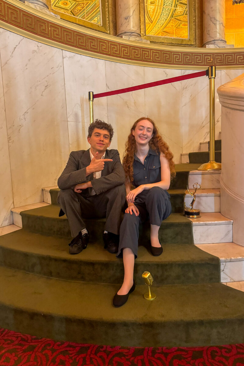 Coltrane Gilman and Renata Schmult pose on the steps after the event