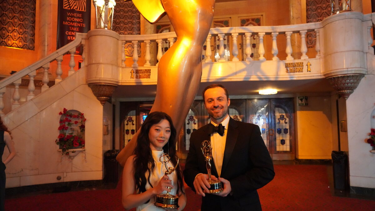 Photo of Catherine and Patterson holding Emmy awards