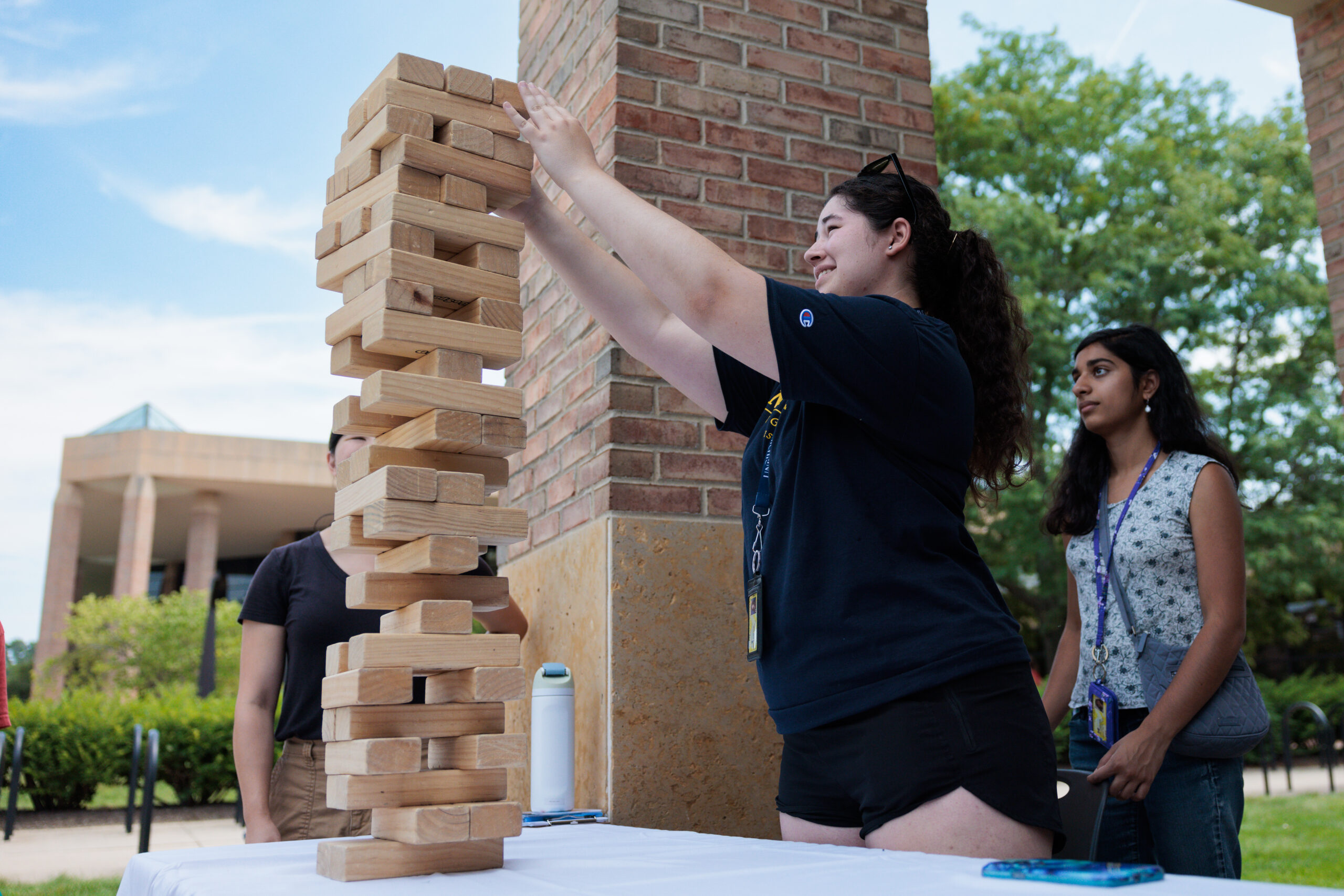Students building blocks outside duderstadt center