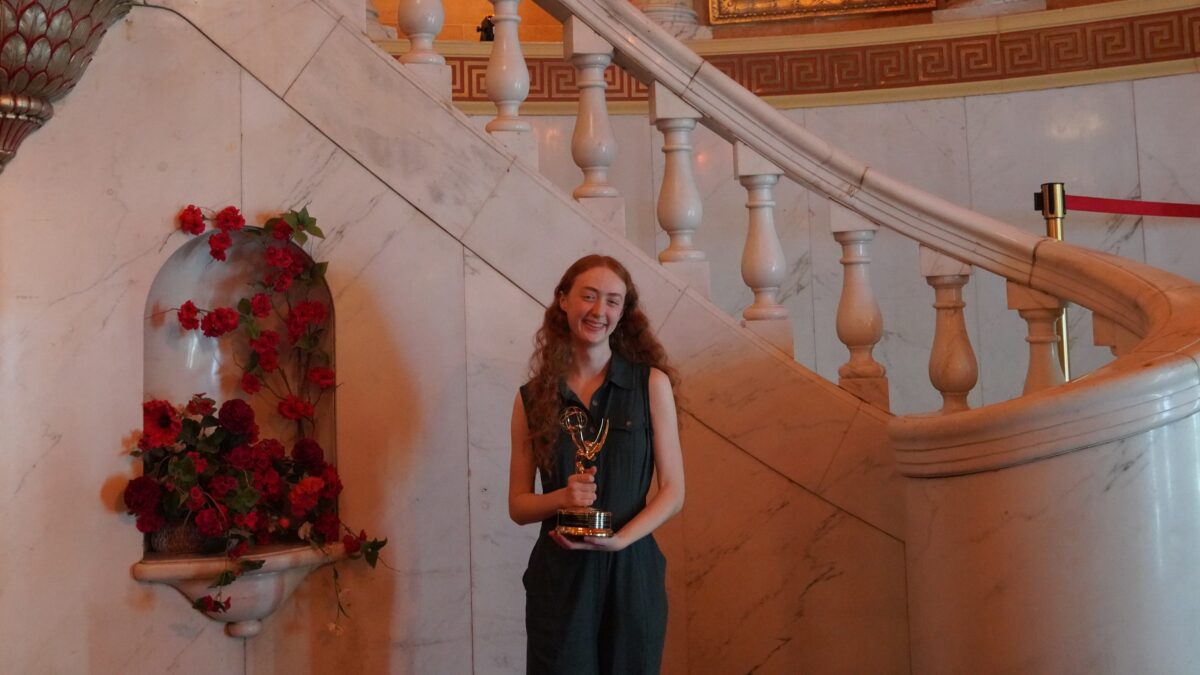 Renata Schmult smiles with her Emmy