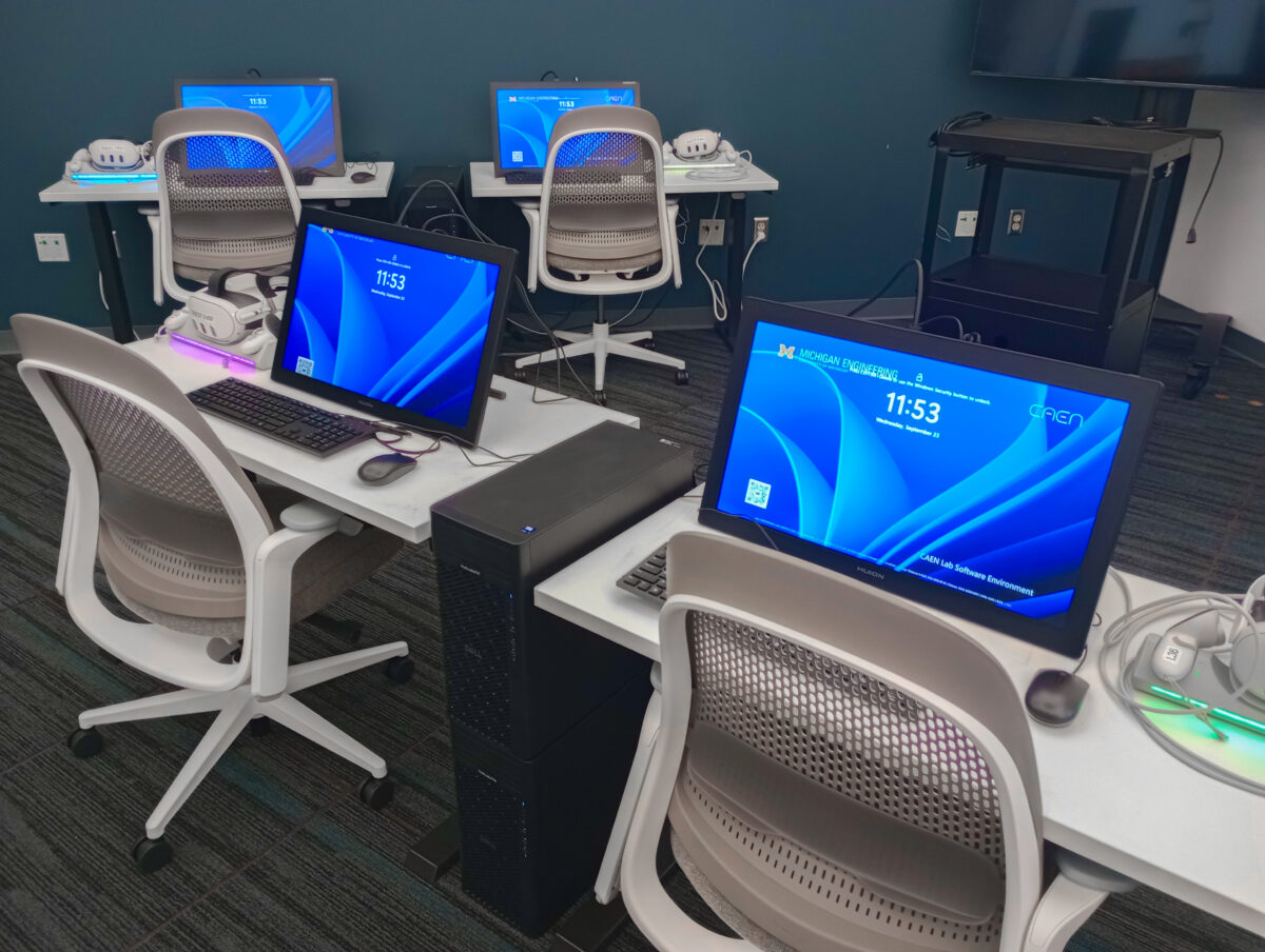New workstations including monitors, VR headsets. and furniture in visualization studio