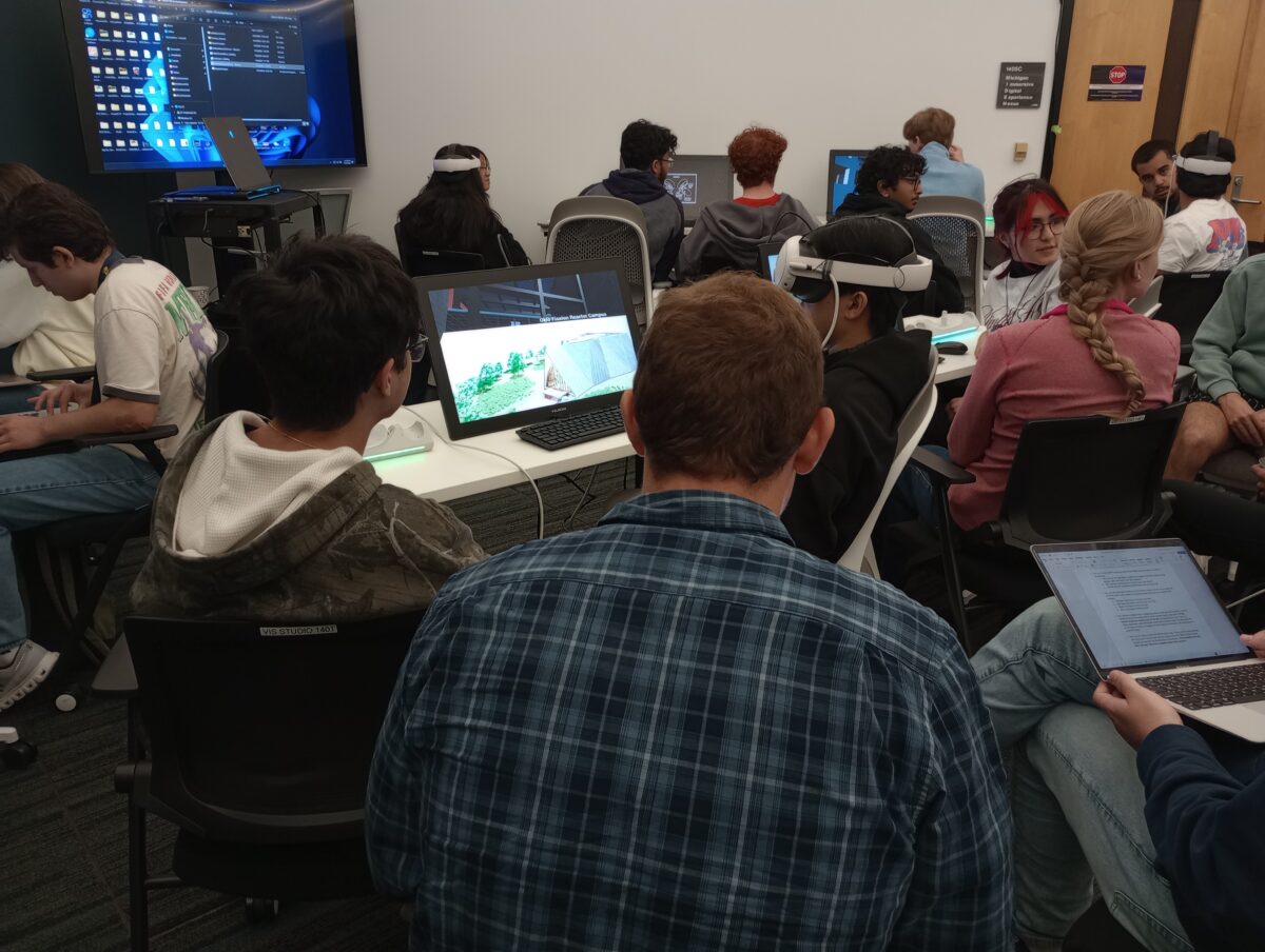 Students at visualization studio using VR headsets