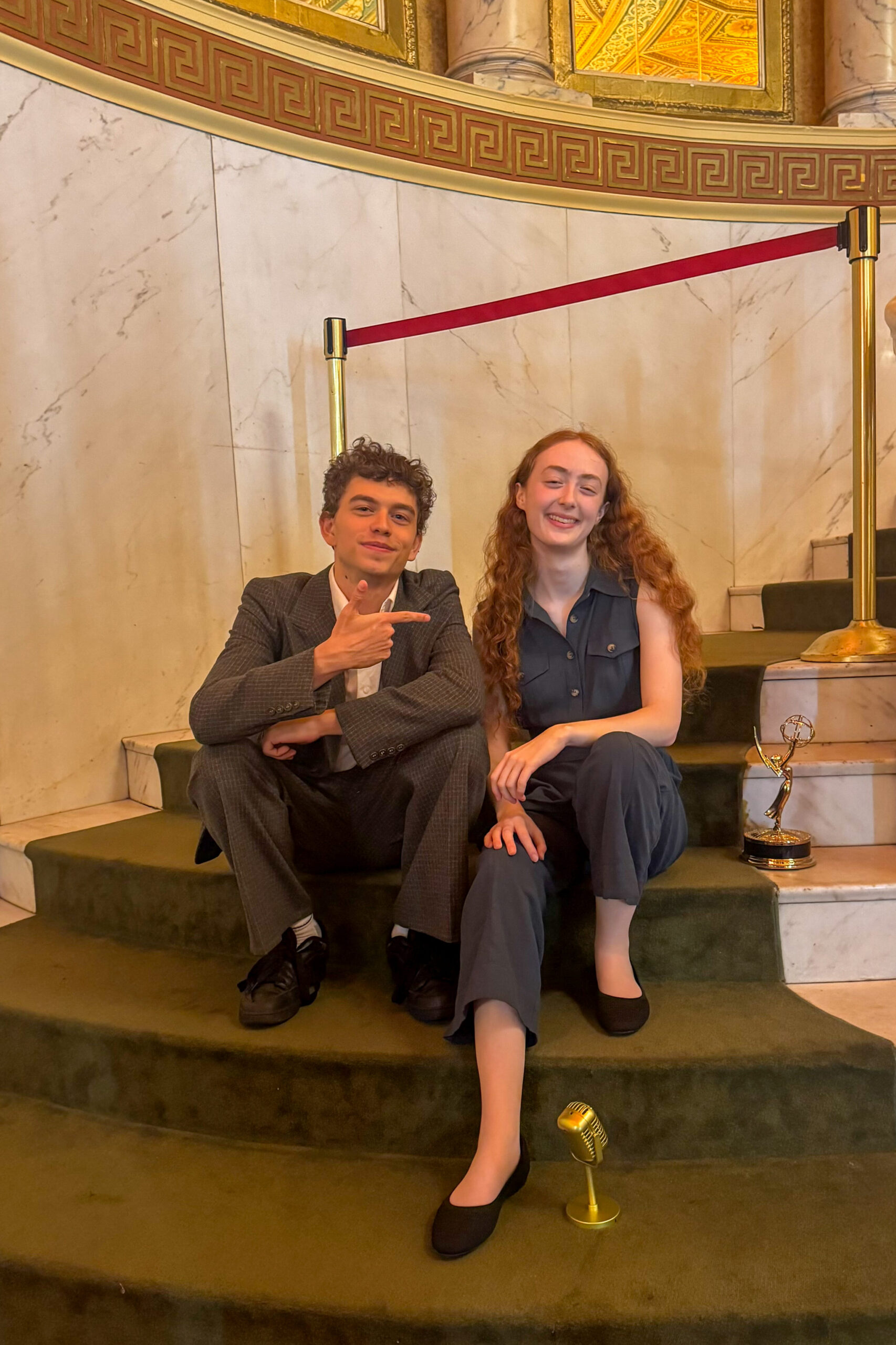 Coltrane Gilman and Renata Schmult pose on the steps after the event