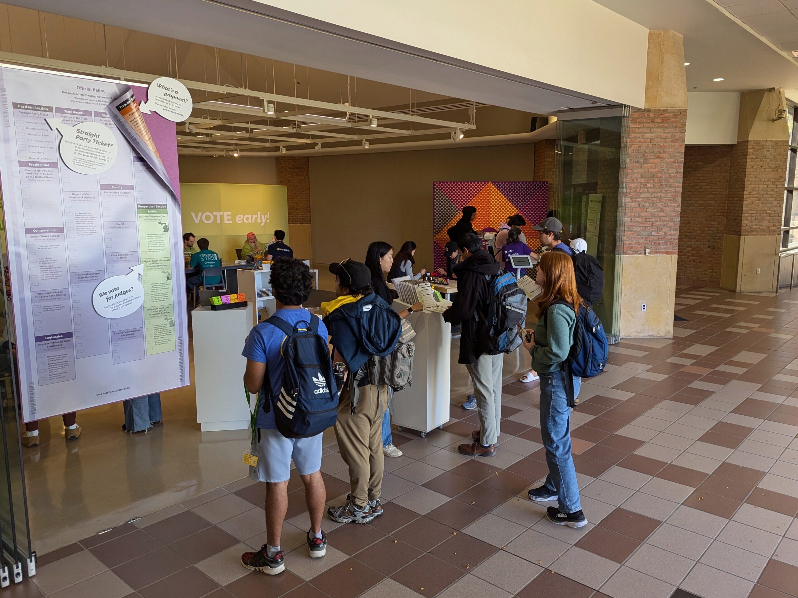 Volunteers addressing students' questions at the Voting Hub.